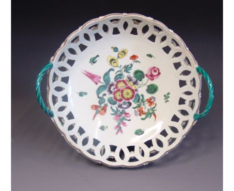 A Worcester circular pierced basket, painted with flowers and green rope twist handles, circa 1770, 21cm diameter including h