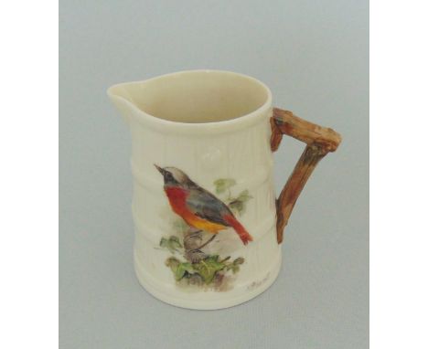 A Royal Worcester small barrel shaped milk jug, painted with a Redstart, signed  W.Powell, circa  1924, green mark * 8 dots, 
