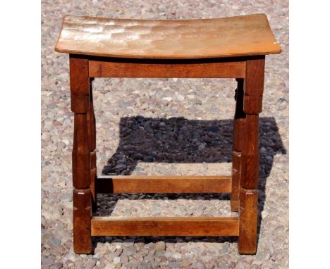 A small 1940/50s Robert Thompson 'Mouseman' oak side table with 'concave' top and tapered ?? facetted supports, the top with 