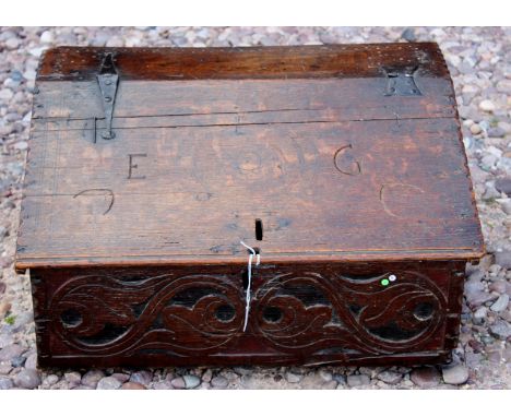 A rare mid 17th Century 'Devon' carved oak boarded desk box with original polychrome decoration, various old iron hinges. Pos