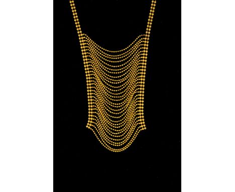 A 9ct gold negligee necklace, the multi-row yellow gold chain drop with two-row bead chain surround continuing to a lobster c