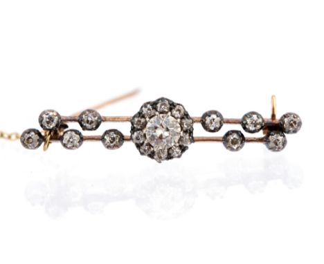 A late Victorian diamond cluster bar brooch, the central round cluster and two knife-edge bars comprising a total of twenty-o
