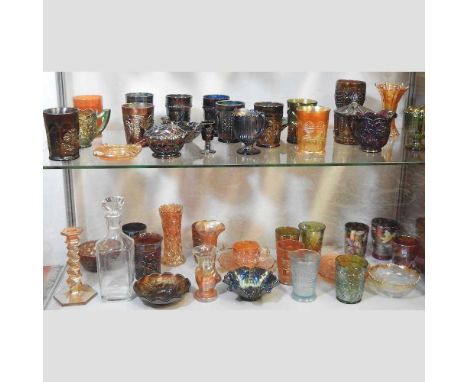 Two shelves of carnival and coloured glass, to include an Australian Kookaburra dish, a candlestick, 18cm high, a Karhula Nig