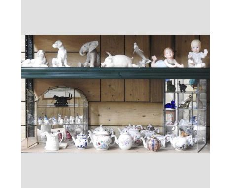 Two shelves of china, to include Nao models of dogs, a Coalport pig, Victoria and Albert museum miniature teapots, Franklin M