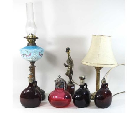 A 19th century cranberry glass decanter, with silver plated mounts, 19cm high, together with three various decanters, a Victo