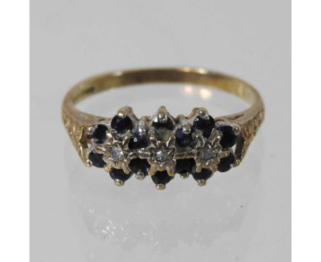 A 9 carat gold sapphire and diamond triple cluster ring, size N, boxed