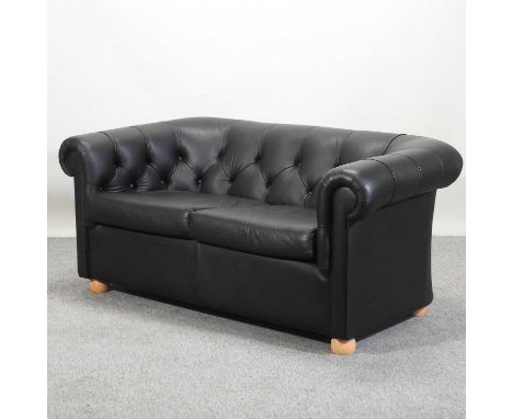 A modern black upholstered chesterfield sofa162w x 92d x 71h cm