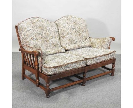 An Ercol floral upholstered sofa, 153cm, together with a pair of matching armchairsSofa 153w x 81d x 91h cm