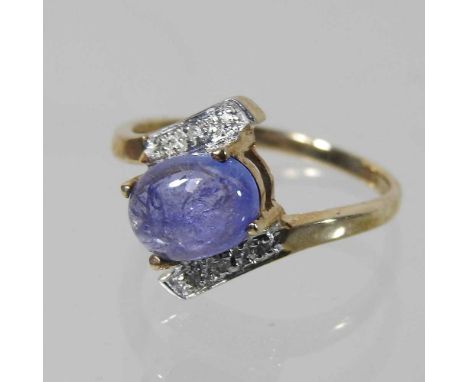 A 9 carat gold diamond crossover cabochon dress ring, size L, boxedCondition report: Condition looks to be ok, with only ligh