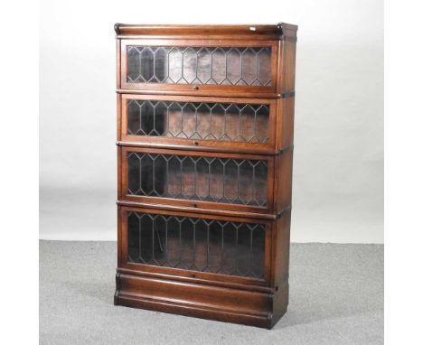 An early 20th century oak Globe Wernicke style bookcase, having four lead glazed graduated tiers,876w x 31d x 147h cmConditio