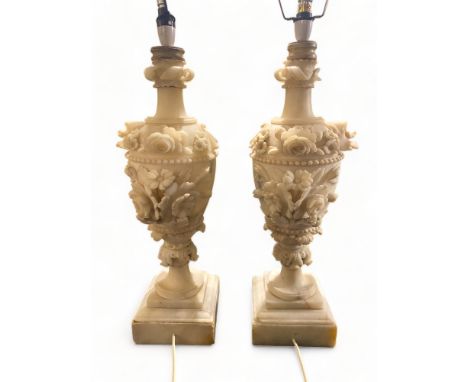 A pair of late 19th century carved alabaster urns converted to table lamp bases
The baluster urn shaped bodies carved with fl