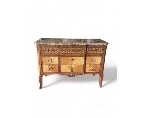 An early 20th century French Transitional style tulipwood and purple wood marquetry commode&nbsp;
The rectangular breakfront 