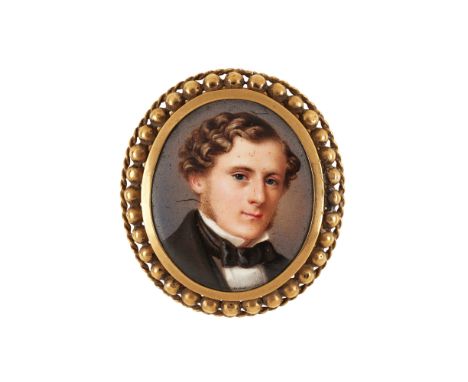 A mid-19th century oval ceramic portrait miniature panel in yellow metal bead and wirework frame
Glazed locket compartment to
