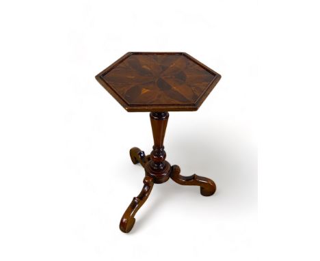 A William and Mary style yew and oyster veneered octagonal tripod table
The octagonal top above a tapering shaft on cabriole 