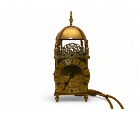 A 17th century style gilt brass lantern clock by M.J. Chapman, dated 1997
The 6" dial foliate etched and with Roman numerals 