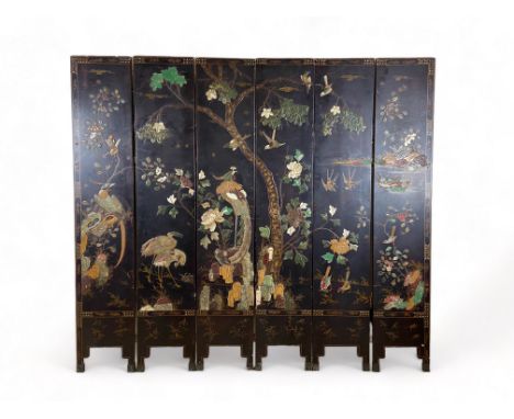 A small late 19th century Chinese black lacquer six fold screen
Heightened with polychrome and gilt chinoiseries, inlaid with