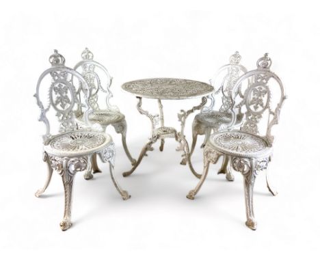 A vintage Victorian style white painted and pierced metal suite of garden dining furniture 
Comprising a table and four chair