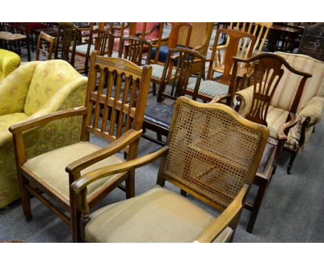 An oak chair, a set of four oak dining chairs, a 19th century oak commode chair (converted), a caned backed open armchair and