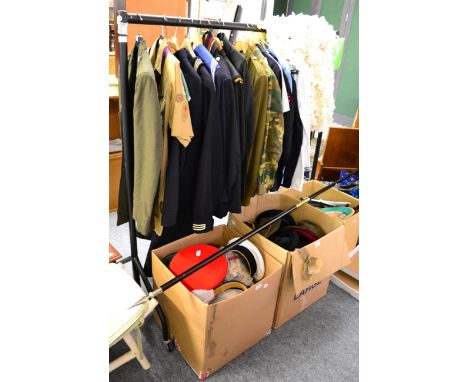 A rail of post-war military uniforms including a British No.2 service dress uniform, various naval uniforms, a Scout shirt wi