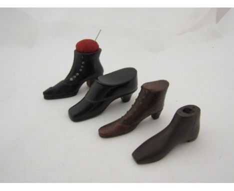 A 19th Century black lacqard paper-mache snuff box made in the form of a shoe, shoe pin cushion and two treen shoes (4) 