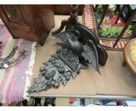 A carved oak shelf in the Black Forest style, 62cm tall 