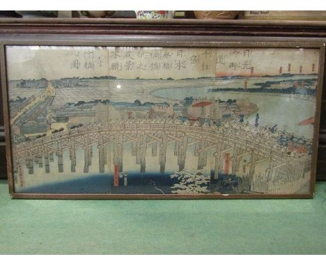 A Utagawa Sadahide (Japanese, 1807 -1878) a triptych woodblock print depicting a procession over a bridge, signed, F and G, 3
