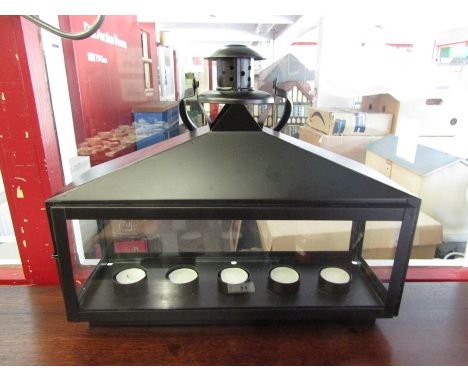 A black metal and glass candle lantern for five candles 