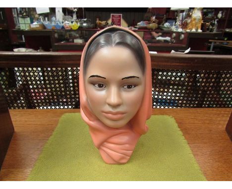 A ceramic bust of a veiled young lady, 25cm height 