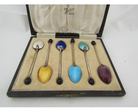 A cased set of six silver and enamel coffee spoons 