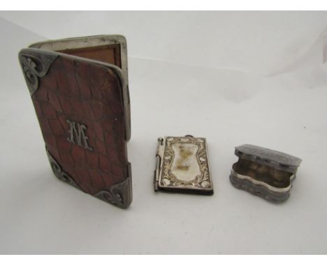 A crocodile card case with silver mounts, central monogrammed letter 'M' marked Birmingham 1930, a white metal and memoir and