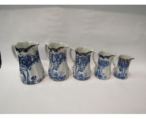 A graduated set of five iron stone blue and white 'Victoria Ware' jugs, Art Nouveau style 