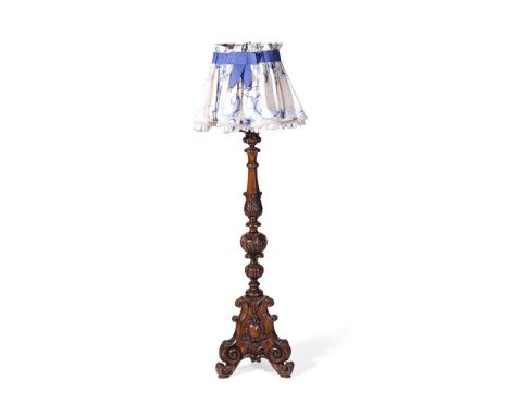 A CARVED WALNUT PRICKET CANDLESTICK IN 17TH CENTURY TASTE  19TH CENTURY AND LATER FITTED FOR ELECTRICITY  126cm high excludin