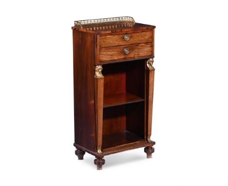 Y&nbspA REGENCY ROSEWOOD AND GILT METAL MOUNTED BOOKCASE IN EGYPTIAN REVIVAL TASTE  CIRCA 1820 Of narrow proportion, with two