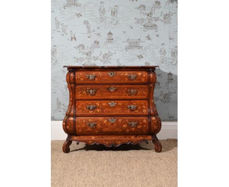 A DUTCH WALNUT AND FLORAL MARQUETRY INLAID COMMODE  EARLY 19TH CENTURY Of bombe outline, the shaped top above an arrangement 