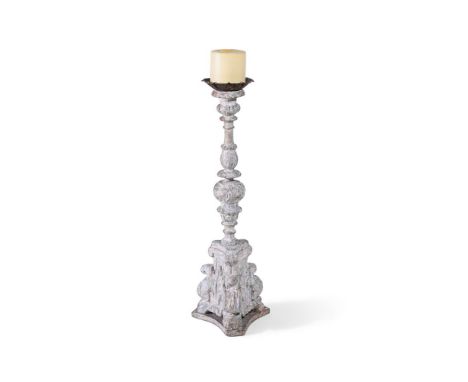 A WHITE PAINTED AND PARCEL GILTWOOD PRICKET CANDLESTICK  18TH CENTURY  95cm high 