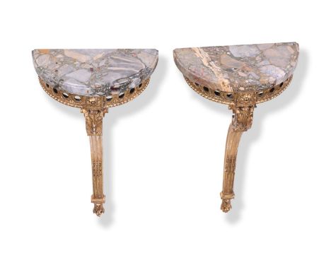 A PAIR OF GILTWOOD CONSOLE TABLES  LATE 19TH OR EARLY 20TH CENTURY Each of semi-elliptical outline above a pierced frieze and