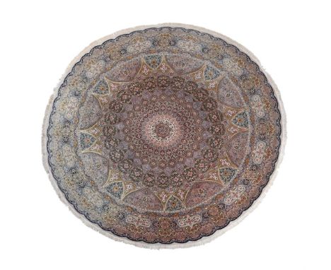 A PART SILK RUG IN TABRIZ STYLE  approximately 390cm diameter Please note:  This lot should be described as 'Tabriz Style' an