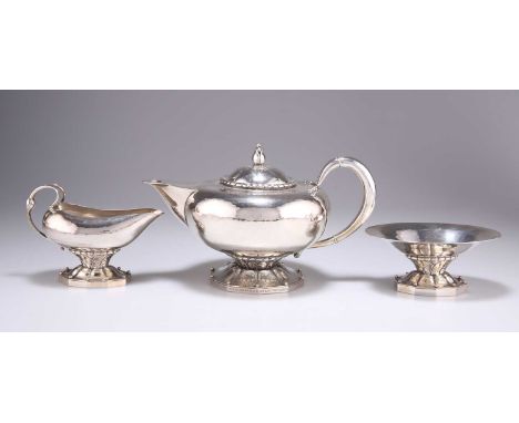 GEORG JENSEN:  A DANISH STERLING SILVER THREE-PIECE TEA SERVICE, CIRCA 1915-1930 by Georg Jensen, import marks, George Stockw