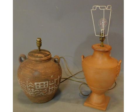An urn shape terracotta lamp base and another similar. H.42cm (tallest) 