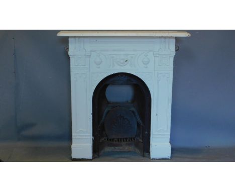 An Edwardian cast iron fire surround with mantle and grate. H.100 W.95cm 