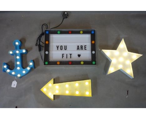 A light up sign together with a light up arrow, star and anchor 