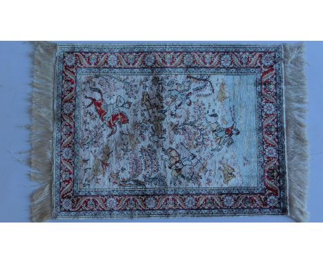 A small Persian silk rug, the central ground depicting men hunting on horseback contained in a burgundy floral border. 63x47c