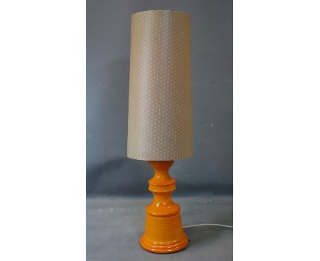A 20th century orange glazed pottery lamp with shade, H.115cm