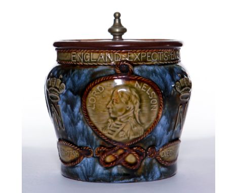 Depicts portrait of Lord Nelson. Piece with metal lid.Piece commemorates the 100th anniversary of the Battle of Trafalgar. Do
