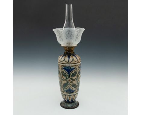 Ornate oil lamp and hood set into a cobalt glazed vase.Marked impressed to bottom EDL, along with several assistant marks and