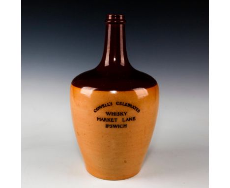 Large dark and light brown salt glazed jug with handle.Advertising ware produced for and stamped to front COWELL'S CELEBRATED