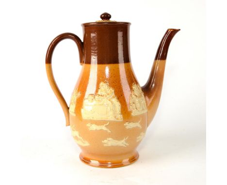 Two-tone pot with relief decorations of hunting scene.Light and dark brown colorway. Royal Doulton impressed backstamp.  Issu