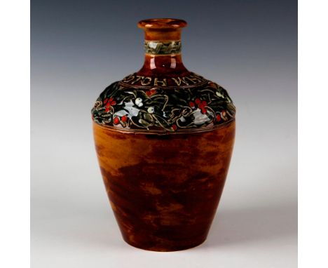 Designed with raised decorations of holly leaves and red berries.Â&nbsp;Stoneware. Embossed SCOTCH WHISKEY. Bottom inscribed 