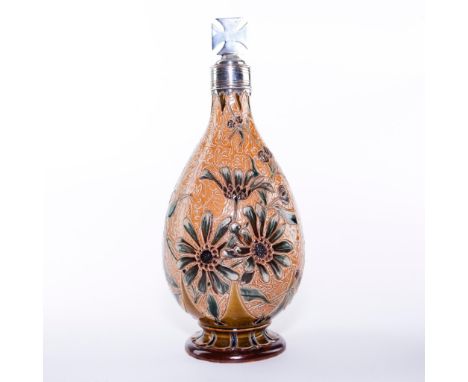 Raised and incised flower decor; signed and stamped to bottom.Unique piece featuring art nouveau flowers on a dark stoneware 