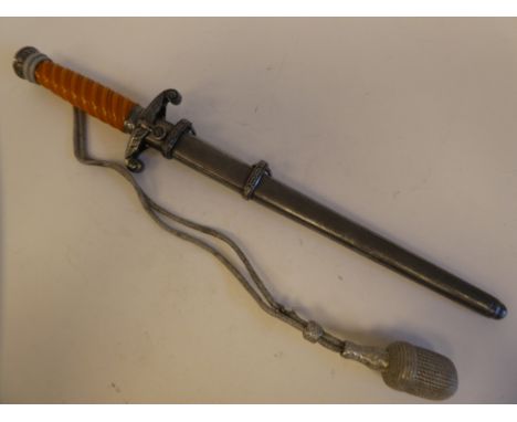 A World War II German officer's dagger with a moulded handle, sheath and silvered thread tie&nbsp; the straight blade 10"L&nb